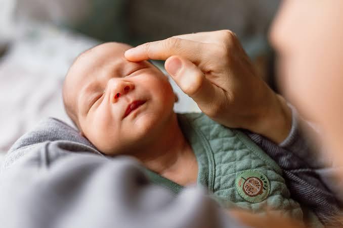 Parent and baby during newborn circumcision care