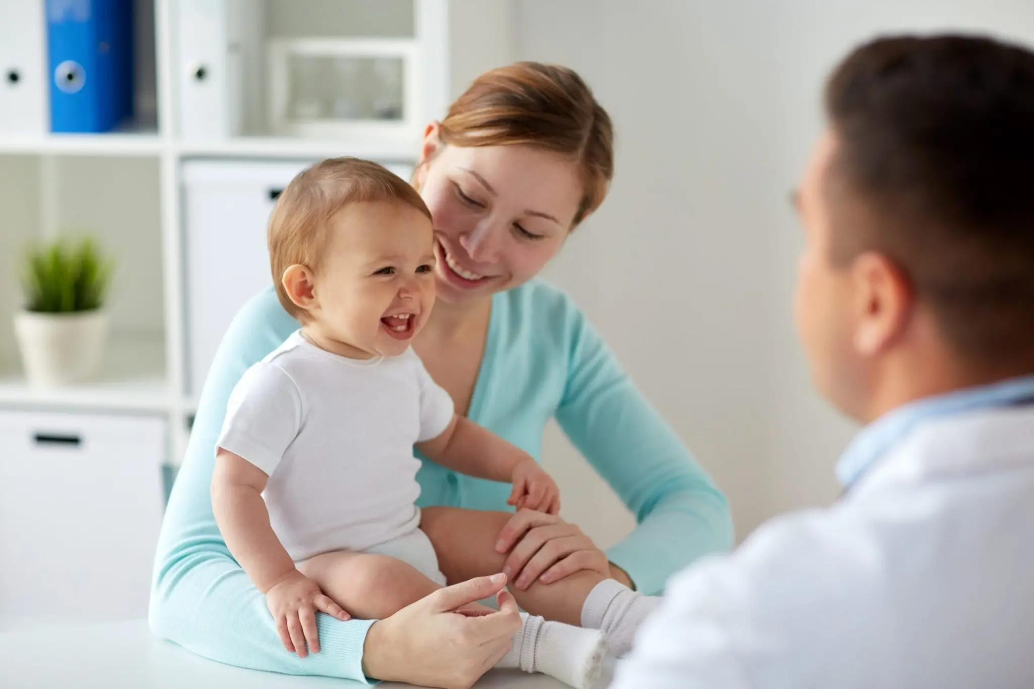 Parents discussing newborn circumcision care with a provider